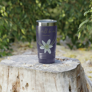 A Catholic purple travel mug with the words "All Will Be Well - St. Joan of Arc" and a Star of Bethlehem flower on it